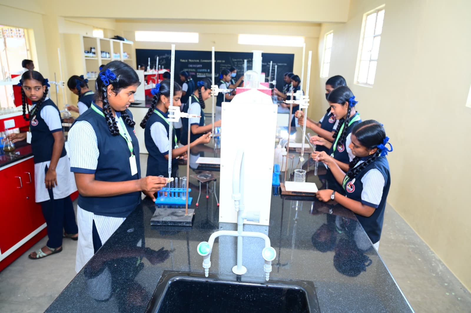 Students doing chemistry practicals in the science laboratory